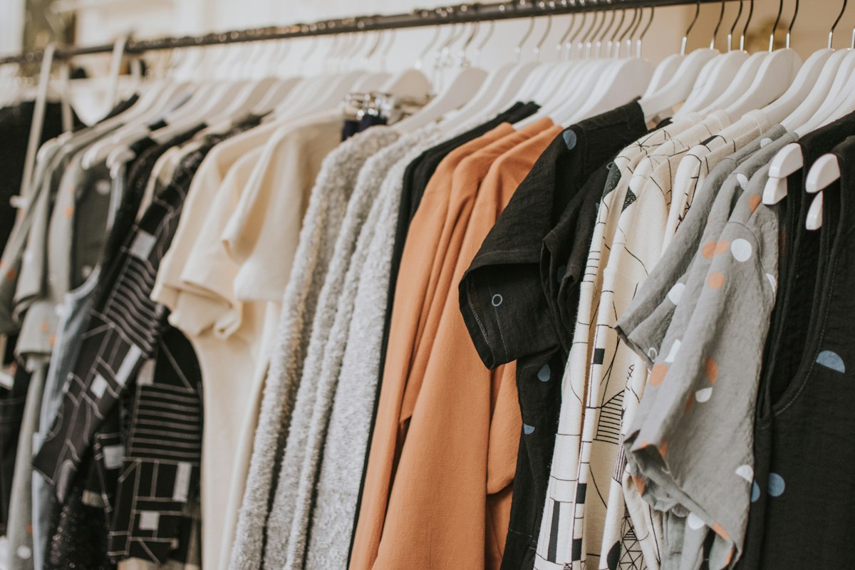 An editorial photograph of clothing on a rail; not a catalogue of products for sale